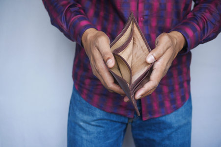 Man hand open an empty wallet with copy spaceの写真素材