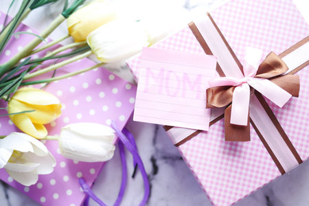 Top view of mother day gift and flower on tableの写真素材