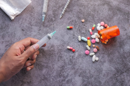 hand holding many syringe with copy space .