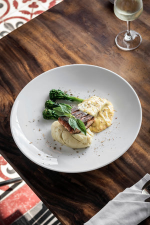 grilled salmon fish fillet with mashed potato and dijon mustard cream sauce