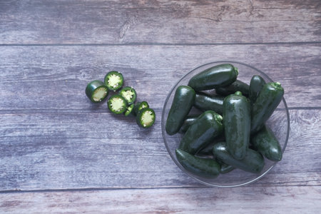 Jalapeno peppers in a bowl on table with copy space ,の写真素材