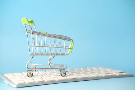 Empty shopping trolly cart on keyboard