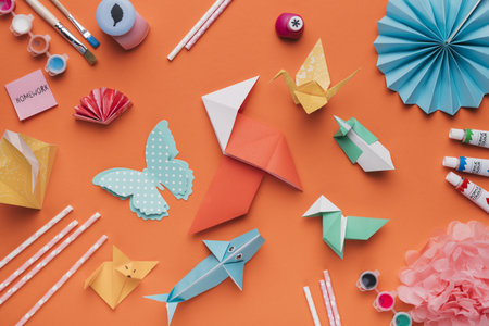 set origami paper art paintbrush watercolor straw orange backdrop. Resolution and high quality beautiful photoの写真素材