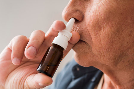 close up old man using nasal sprayの写真素材