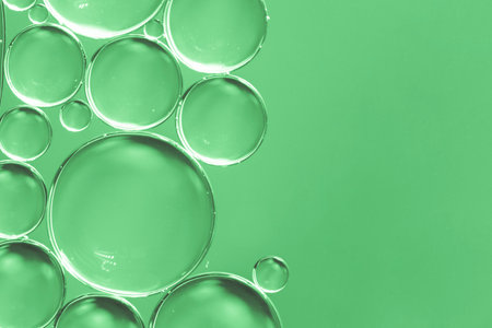 abstract air bubbles liquid green backgroundの写真素材