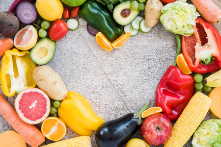 heart shape made with colorful vegetables textured backdrop