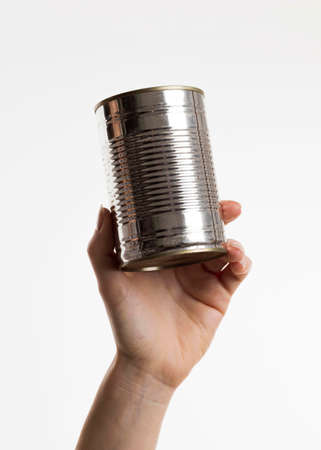 hand holding tin canの写真素材
