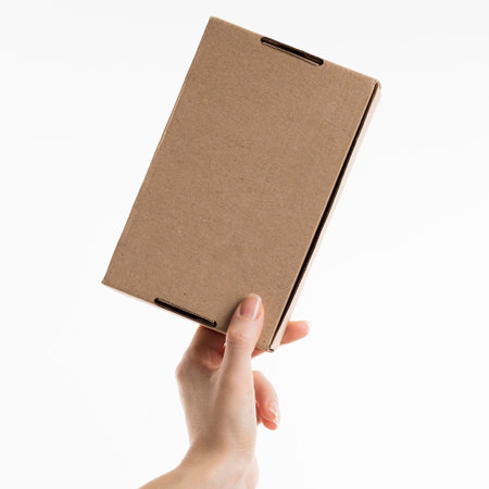hand holding cardboard box