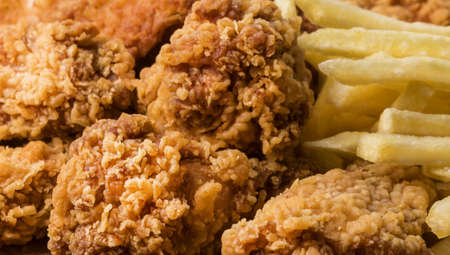 close up fried chicken wings with fries. High quality and resolution beautiful photo conceptの写真素材