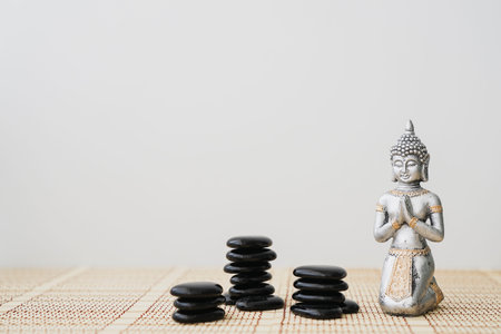 buddha figure with black stones