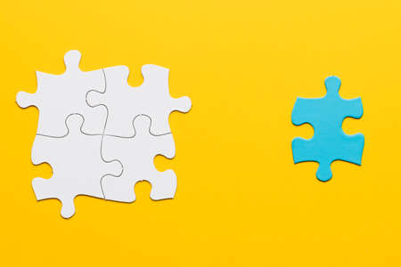 joint white puzzle blue single piece yellow surfaceの写真素材