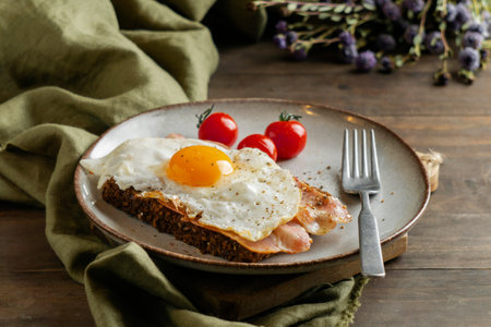 breakfast with egg bacon tomatoes high angle