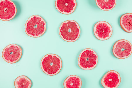 pattern grapefruit citrus slices pastel backdrop. Resolution and high quality beautiful photoの写真素材