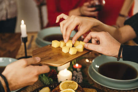 friends eating cheese christmas. Resolution and high quality beautiful photoの写真素材