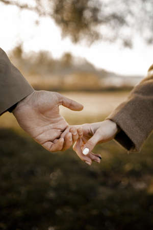 close up couple holding hands outside. High quality and resolution beautiful photo conceptの写真素材