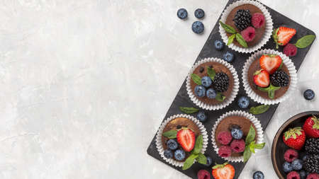 flat lay tasty muffin with forest fruit. High quality and resolution beautiful photo conceptの写真素材