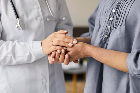covid recovery center female doctor holding elder patient s hands