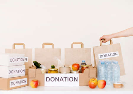 front view donation boxes bags with foodの写真素材