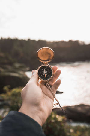 crop hand with compass natureの写真素材