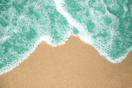 close up top view bubbly water tropical sandy beach
