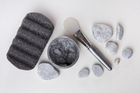pumice stone spa stones clay mask brush white backgroundの写真素材