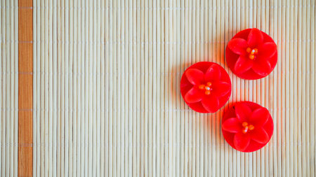 red flower shaped candlesの写真素材
