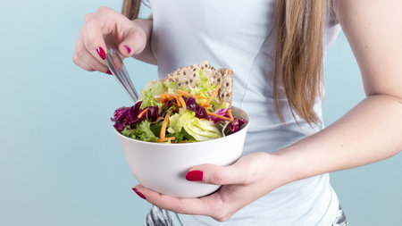 woman holding big bowl with vegetable salad. Resolution and high quality beautiful photoの写真素材