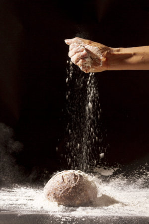 hand pours flour baked bread. Resolution and high quality beautiful photo