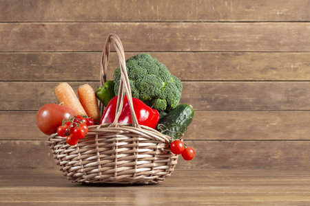 wooden background with basket full vegetables. Resolution and high quality beautiful photoの写真素材