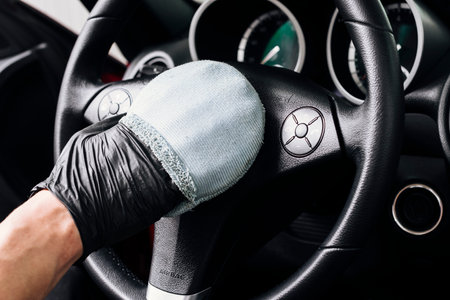 close up person cleaning car interiorの写真素材
