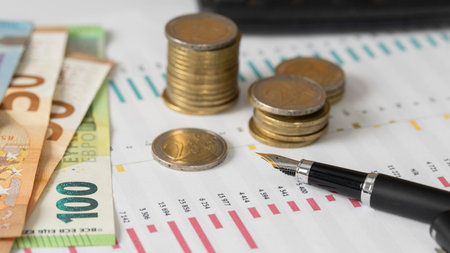 high angle coins banknotes arrangementの写真素材