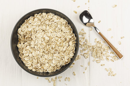oatmeal bowl with spoon on the table . Resolution and high quality beautiful photo