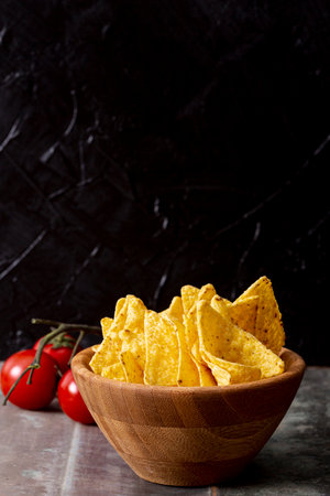 tasty nachos wooden bowl tomatoesの写真素材