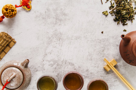 hot green tea two traditional chinese clay ceramic cup teapot with tasselの写真素材