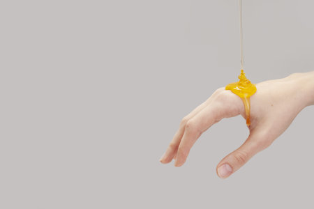 organic honey pouring hand . Resolution and high quality beautiful photo