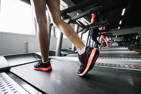 woman wearing sneakers using treadmill. Resolution and high quality beautiful photoの写真素材