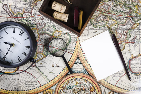 elevated view clock magnifying glass colorful ancient map. Resolution and high quality beautiful photoの写真素材