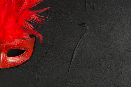 red mask dark tableの写真素材