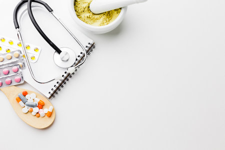 wooden spoon filled with pills top view copy spaceの写真素材