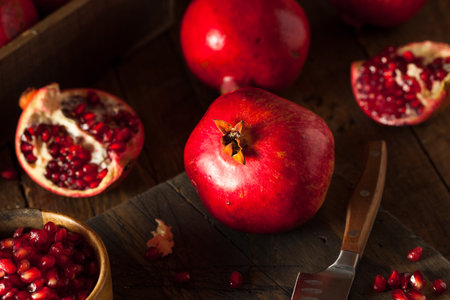 Raw Organic Red Pomegranates Ready to Eatの写真素材