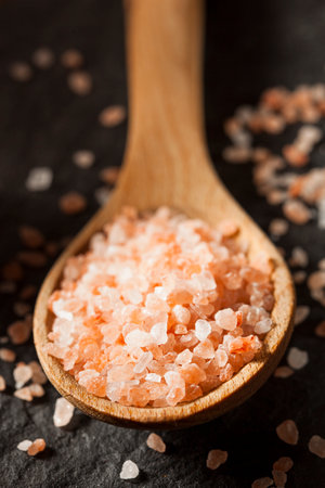 Raw Pink Himalayan Sea Salt in a Spoonの写真素材
