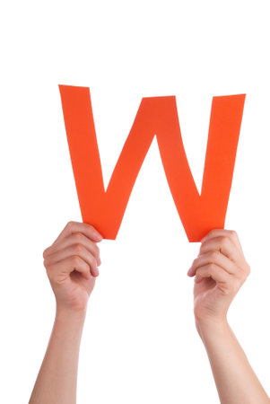 a hand holding an orange w isolatedの写真素材