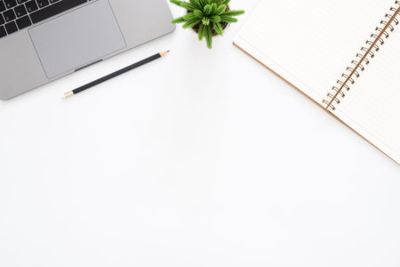 Creative flat lay photo of workspace desk. Top view office desk with laptop, pencil, notebook and...