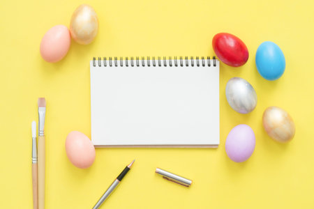 Flat lay top view colorful easter egg painted in pastel colors composition and mock up blank...