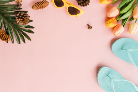 Creative flat lay photo of travel vacation spring or summer tropical fashion. Top view beach accessories on pastel pink color background with blank space for text. Top view copy space photography.の写真素材