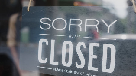 Sorry we're closed vintage black and white retro sign on a coffee glass door cafe after virus lockdown quarantine. Owner small business, food and drink, business financial crisis concept.の写真素材