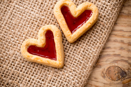 Heart-shaped cookies on a wooden background. Studio picture.の写真素材