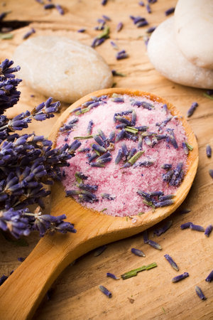 Wooden spoon with lavender sea salt. Spa stones.の写真素材
