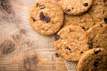 Oatmeal cookies on a wooden background. Studio photography.の写真素材