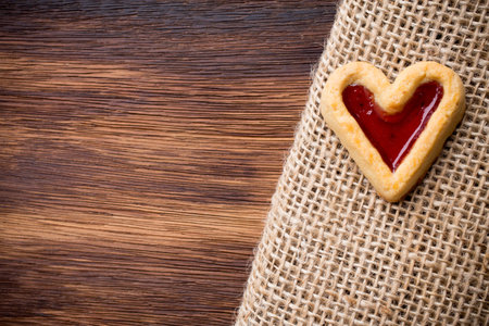 Heart-shaped cookies on a wooden background. Studio picture.の写真素材